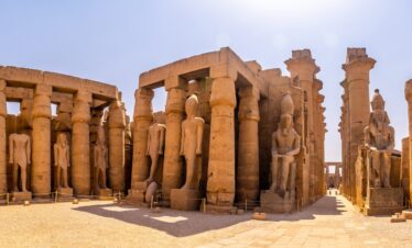 Sculptures of pharaohs and ancient Egyptian drawings on the columns of the Luxor Temple